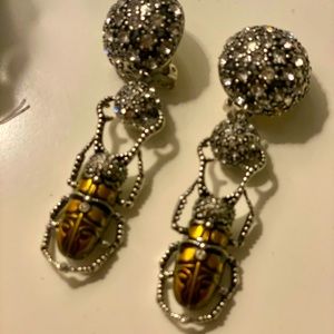 Iris Afpel bug clip on earrings.